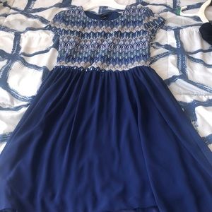 A navy blue dress that has a beautiful design!!